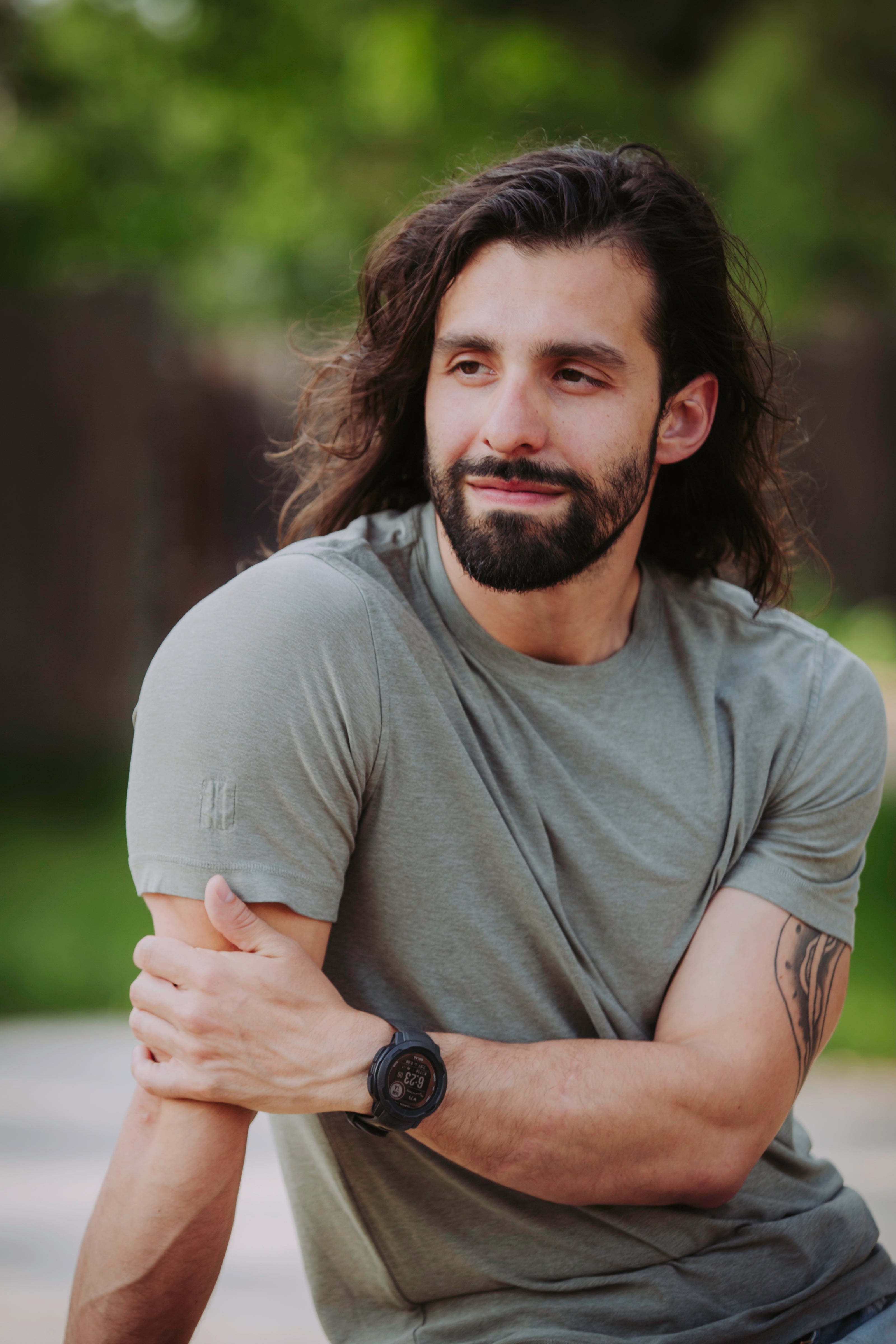 Headshot of Eric Bragas, founder of The Microdose Journal, smiling outdoors with a relaxed and approachable demeanor.